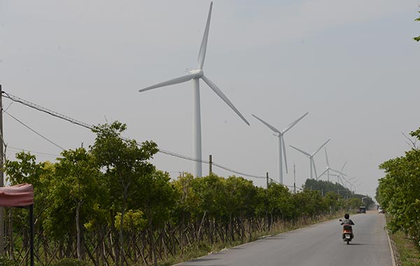 Wind turbines along a road