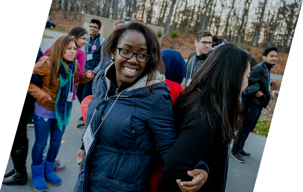 Two women participating in a teambuilding exercise during Global Engagement & Leadership Experience